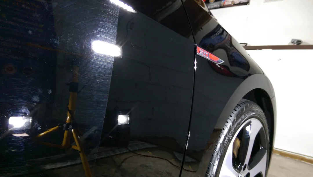 Volkswagen Golf GTi undergoing paint correction and ceramic coating treatment