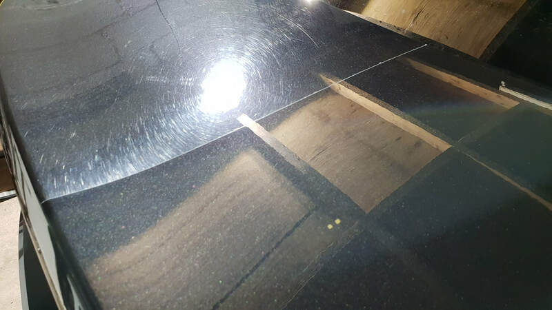 BMW 3 Series undergoing paint correction and ceramic coating treatment