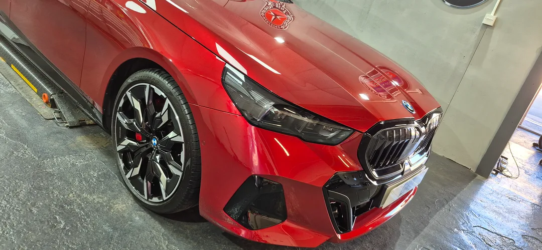 Fire Red BMW i5 after new car ceramic coating in Paisley