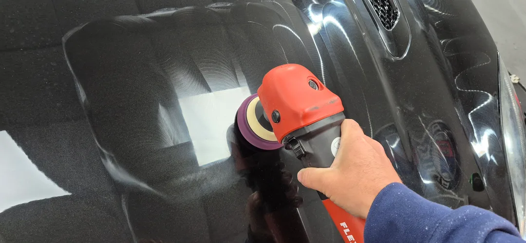 Cutting stage machine polish being carried out on Jaguar F-Type bonnet