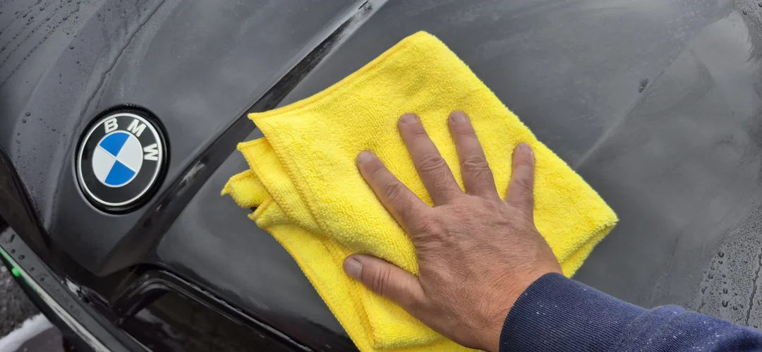 Tar and Glue remover being used on bonnet as part of the decontamination stage