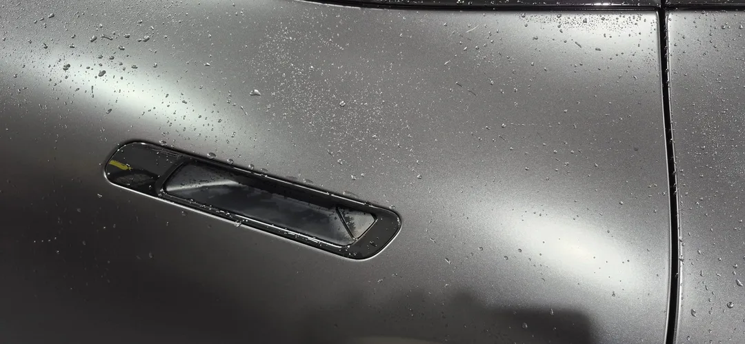 BMW iX M70 near side rear door before drying