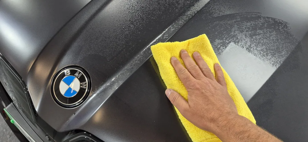 Panel wipe being used on bonnet as part of the decontamination stage