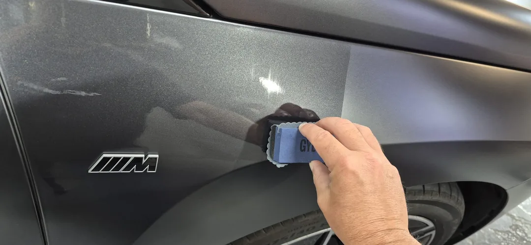 Gyeon Matte Evo ceramic coating being applied to BMW iX M70 wing panel at DMD Car Detailing in Paisley near Glasgow