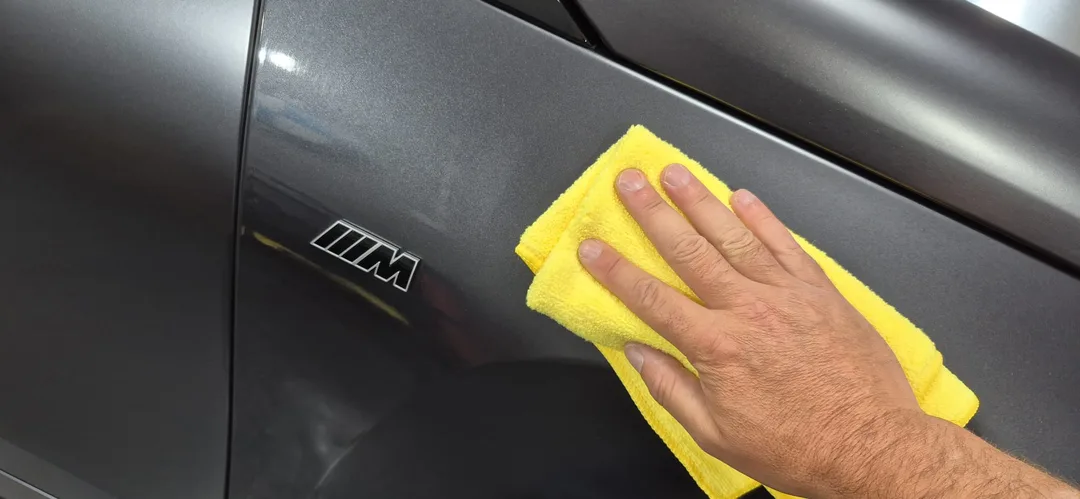 Gyeon Matte Evo ceramic coating being leveled on BMW iX M70 wing panel at DMD Car Detailing in Paisley