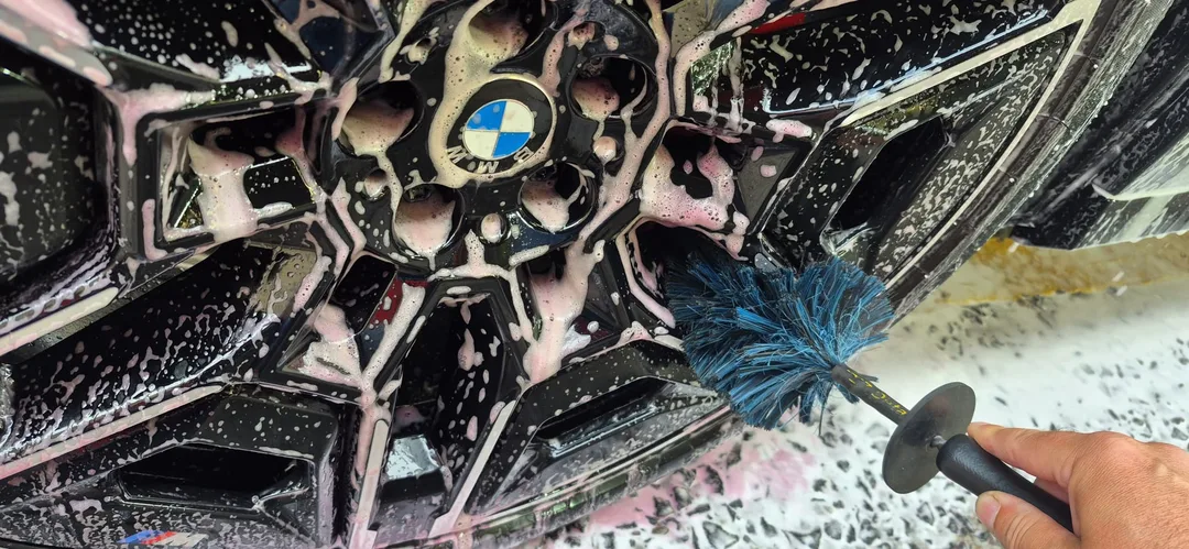 BMW iX M70 wheel barrel being cleaned