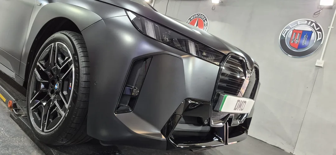 BMW iX M70 front bumper after matte paint protection detail