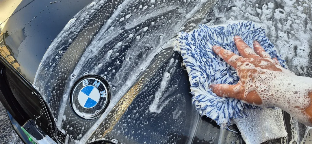 BMW iX M70 paintwork going through a safe wash, ready for coating at DMD Car Detailing in Paisley near Glasgow